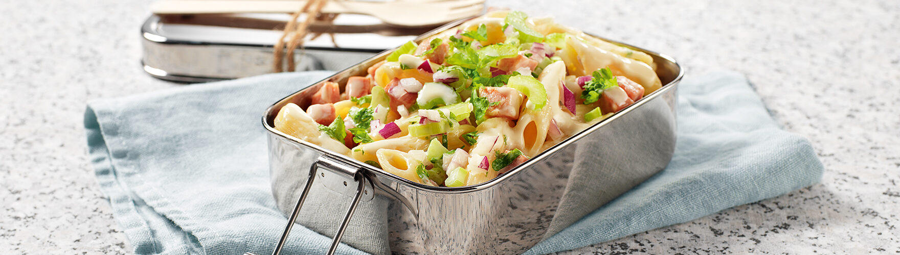 Pasta salad with diced ham, red onion and celery