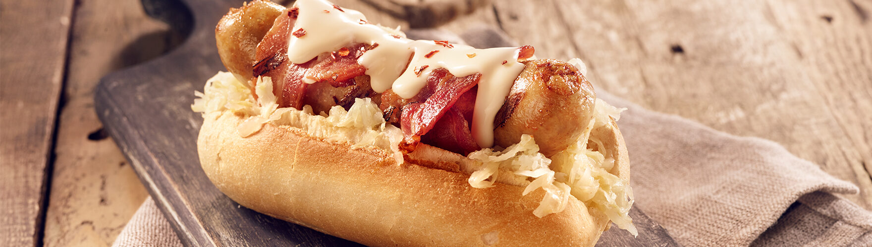 Hot dog with sauerkraut and bacon