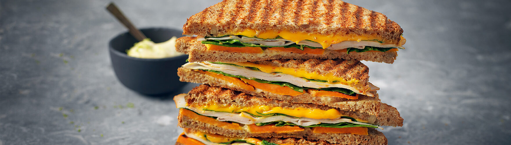 Toastie with cheddar, chicken breast, spinach, sweet potato and lime mayonnaise