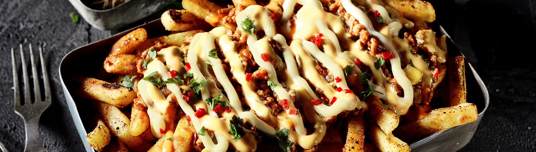 Loaded fries with minced meat and mature cheese